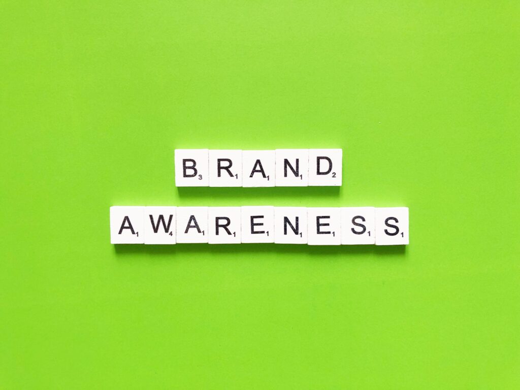 Minimal tile layout on a green backdrop illustrates how to increase brand awareness.