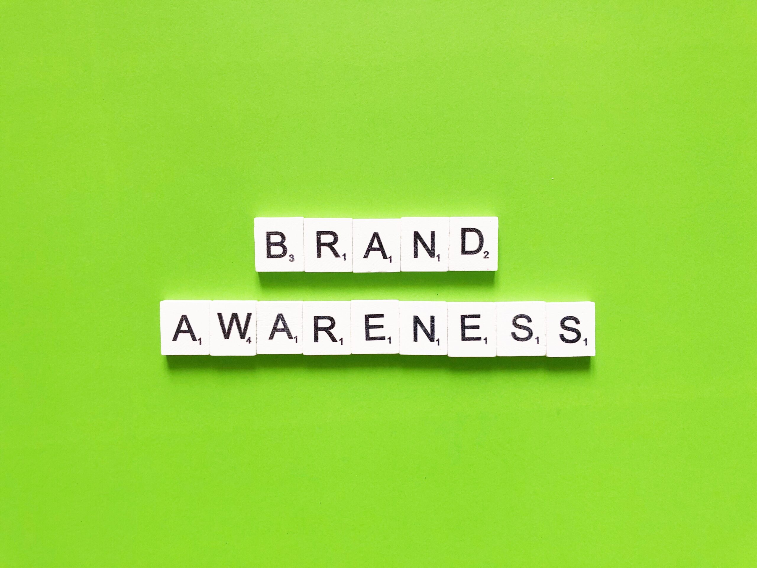 Minimal tile layout on a green backdrop illustrates how to increase brand awareness.
