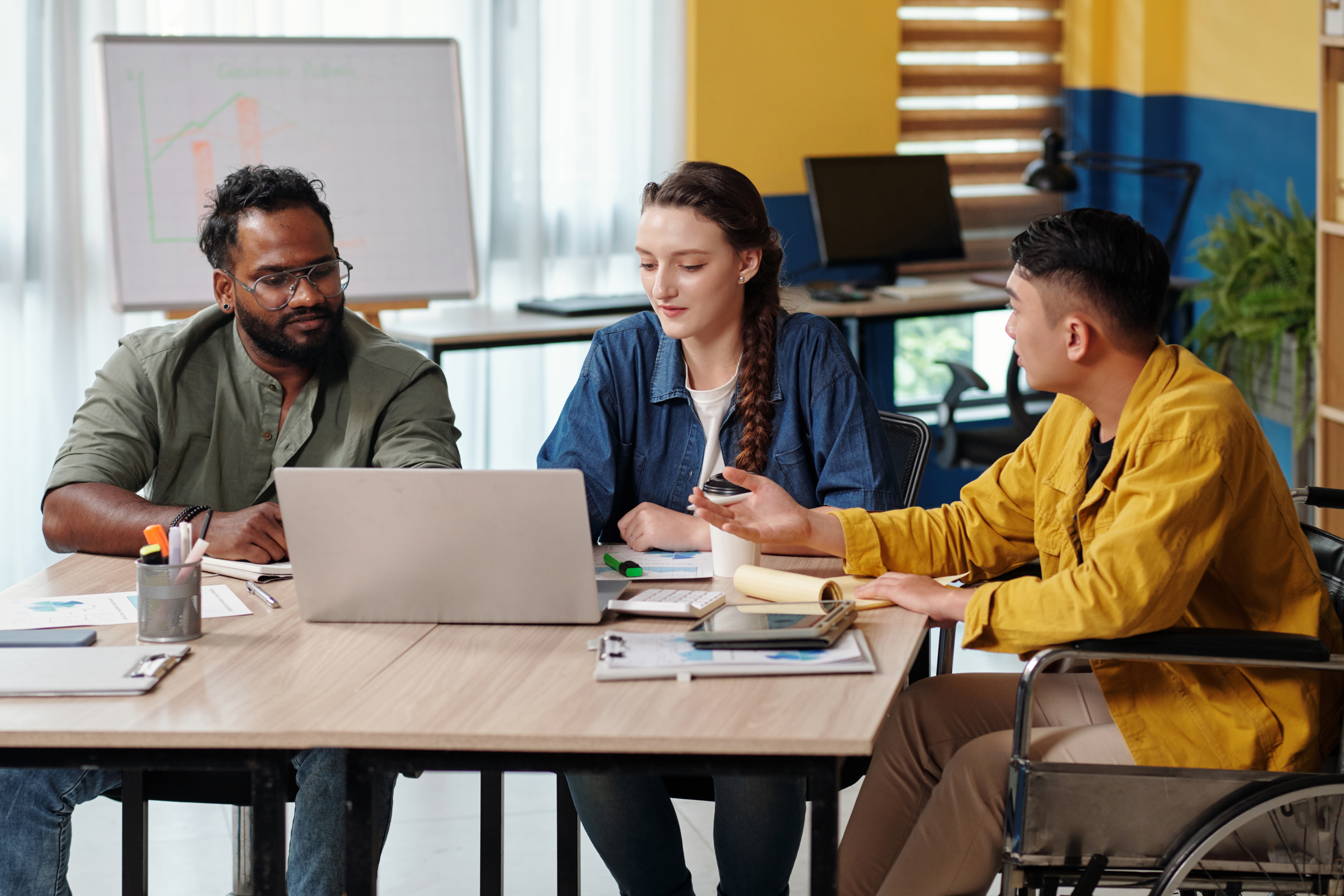 Young professionals collaborating during a marketing internship.